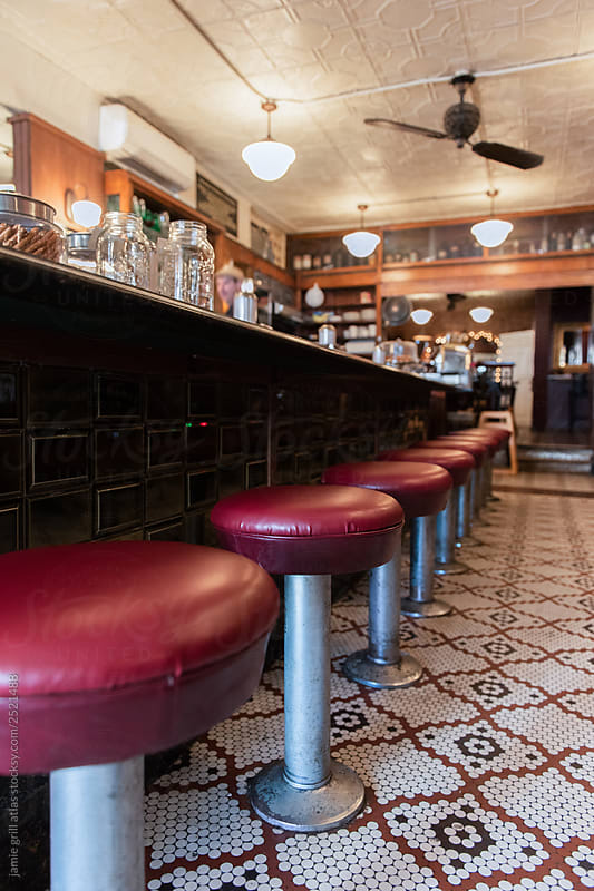 Stools along the counter of an independent lunch counter